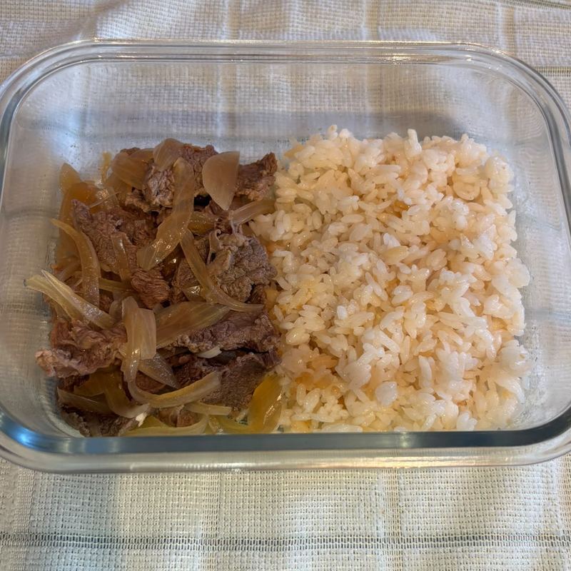 Gyudon beef and onion with rice in a meal prep container