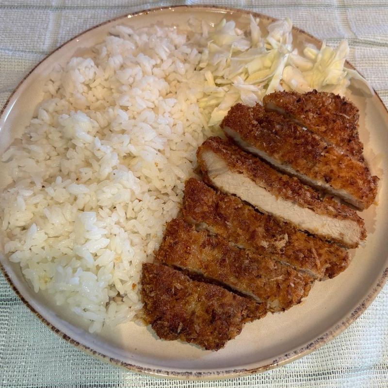 Sliced tonkatsu with rice and shredded cabbage