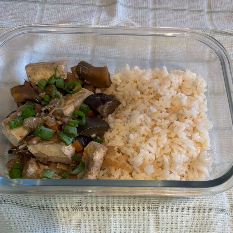 Veggie mapo tofu with rice in a meal prep container