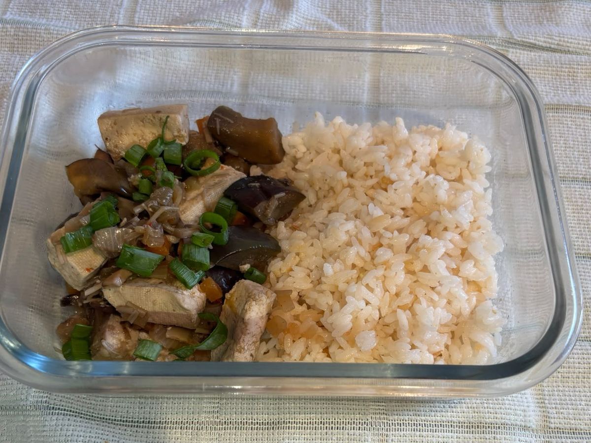 Veggie mapo tofu with rice in a meal prep container